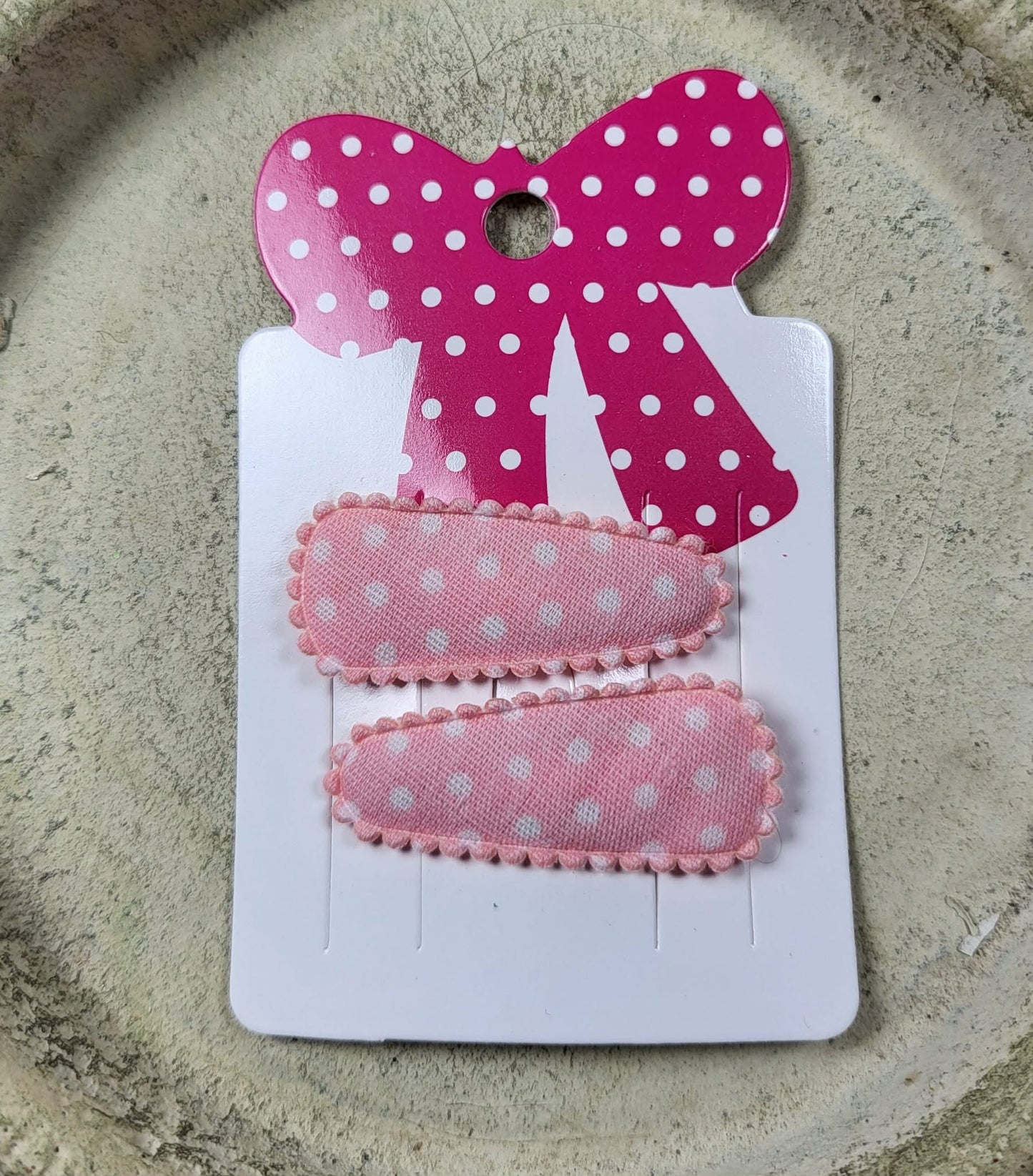 Baby klikspeld lichtroze met witte stippen