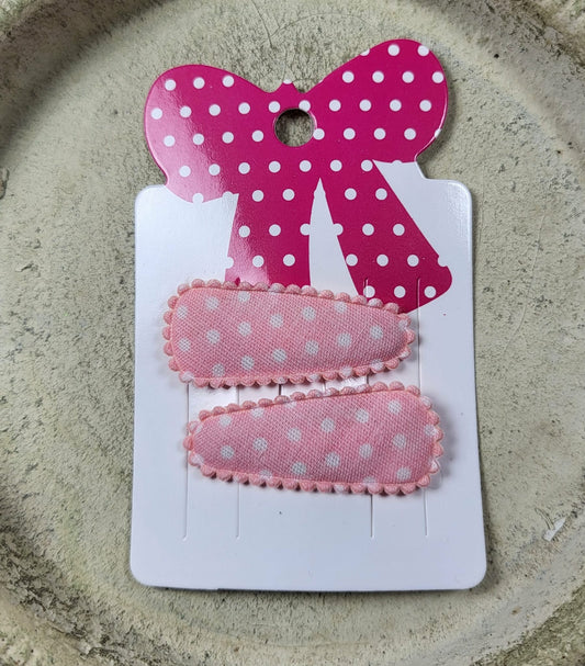 Baby klikspeld lichtroze met witte stippen