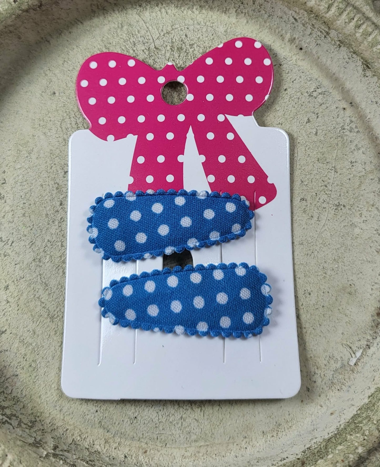 Baby klikspeld donkerblauw met witte stippen