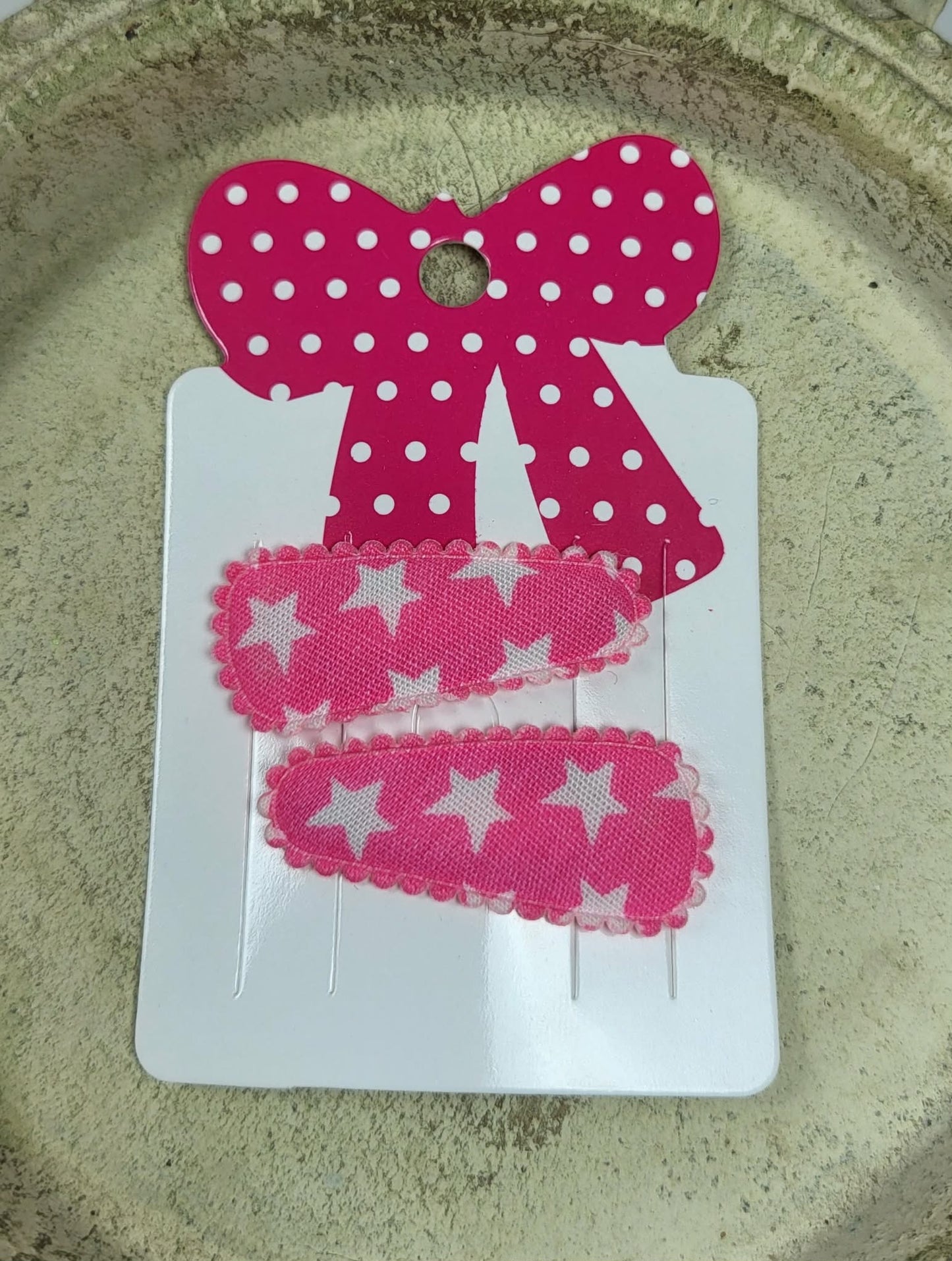 Baby klikspeld roze met witte sterren