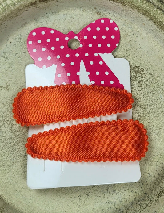 Kind klikspeld satijn oranje