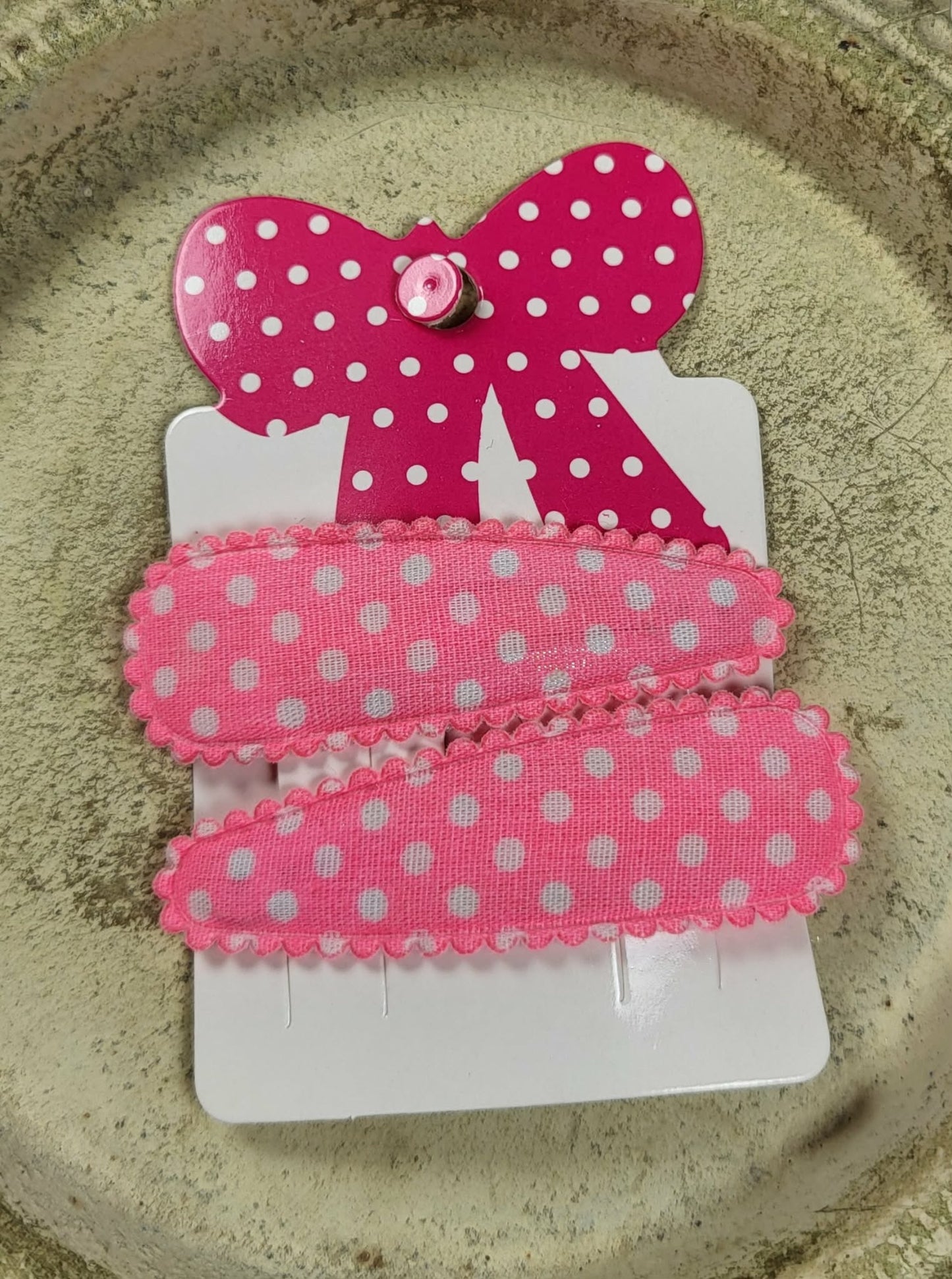 Kind klikspeld roze met witte stippen