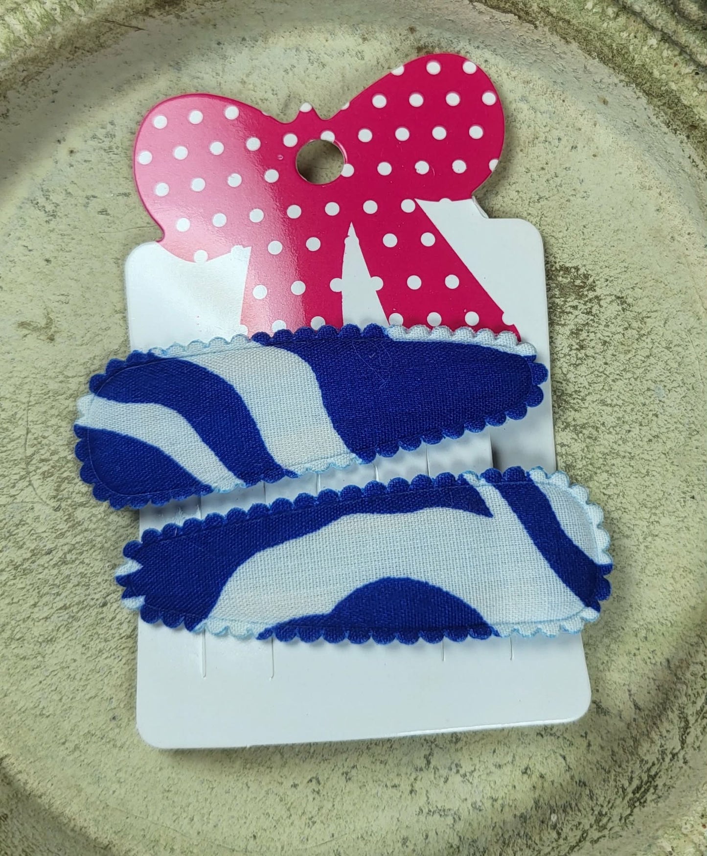 Kind klikspeld blauw en witte golven