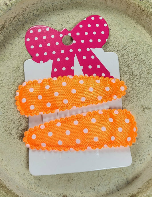 Kind klikspeld satijn oranje met witte stippen