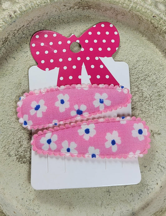 Kind klikspeld roze met witte bloemen