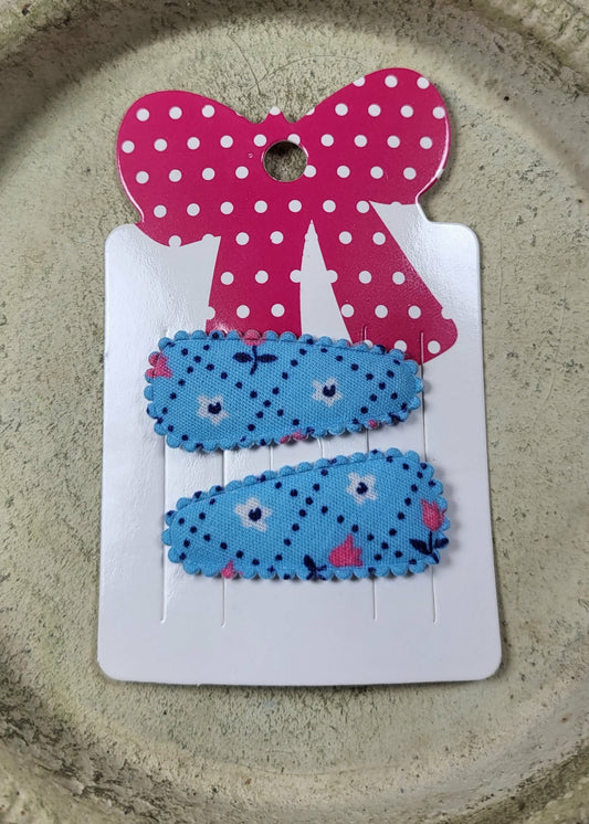 Baby klikspeld blauw met kleine bloemetjes