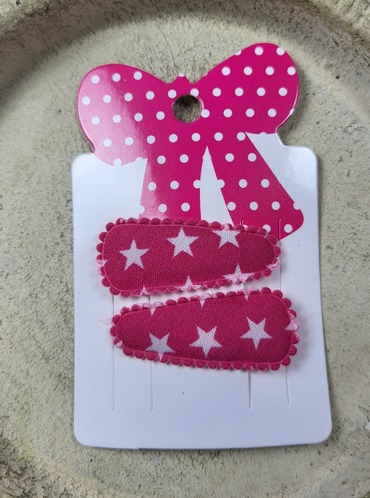 Baby klikspeld donkerroze met witte sterren