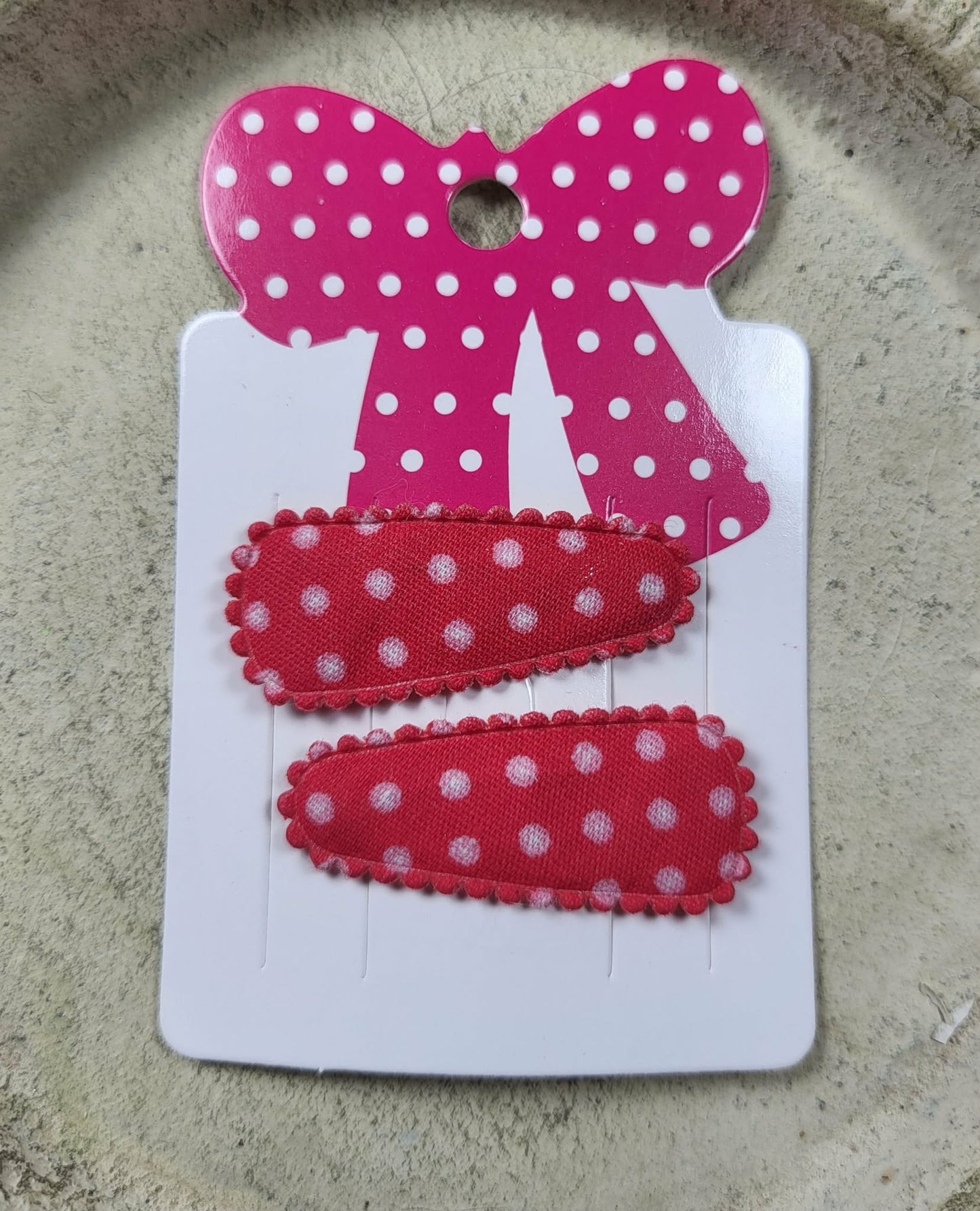 Baby klikspeld rood met witte stippen