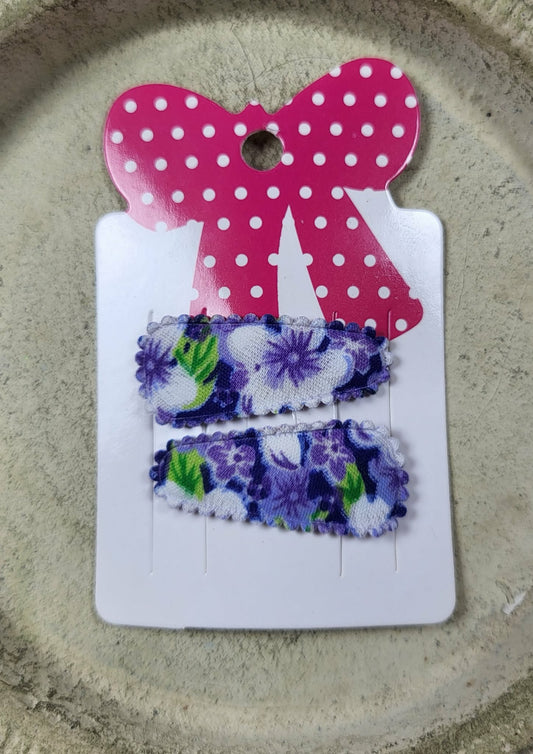 Baby klikspeld met paarse bloemen