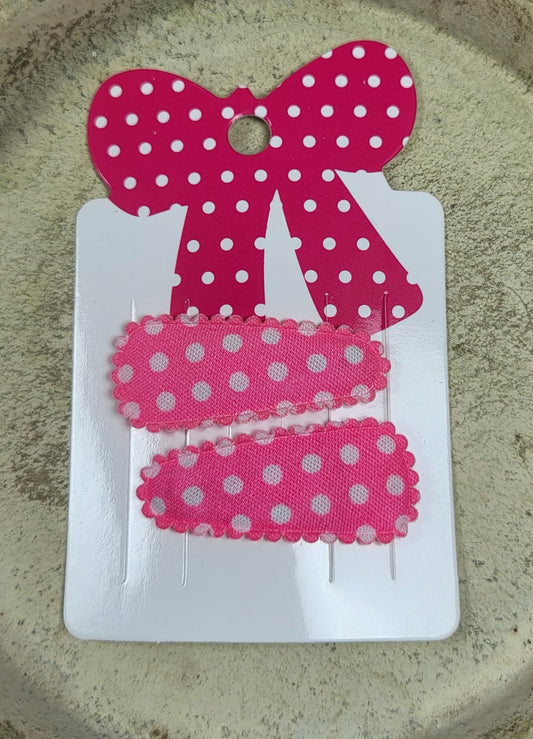 Baby klikspeld roze met witte stippen