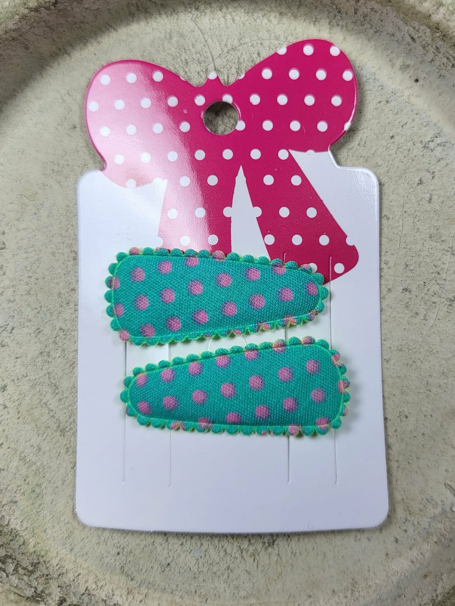 Baby klikspeld groen met roze stippen