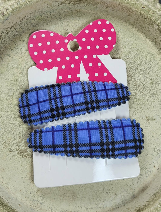 Kind klikspeld blauw schots patroon