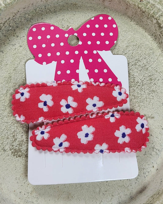 Kind klikspeld rood met witte bloemen