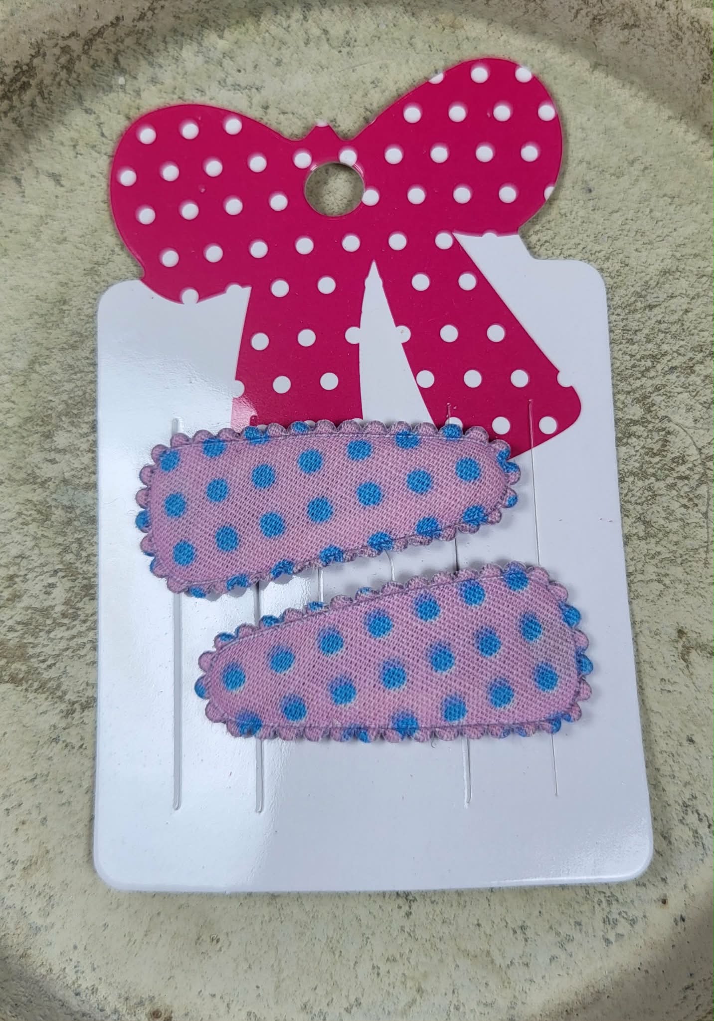 Baby klikspeld roze met blauwe stippen